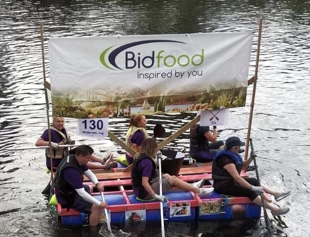 Local foodservice provider takes on 6-mile challenge to race down the river rye in a homemade raft