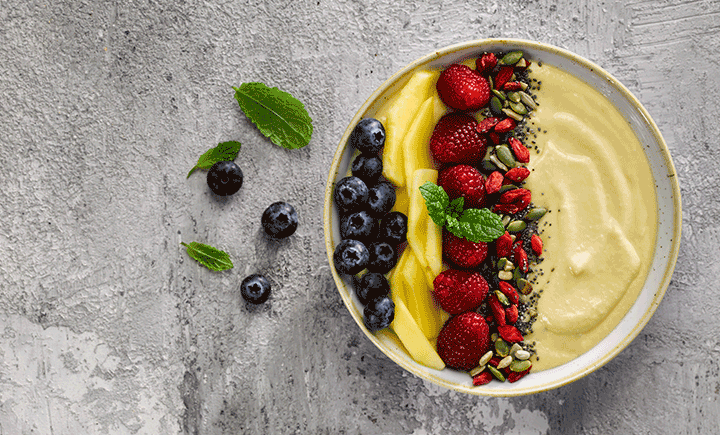 Coconut, mango & fresh fruit smoothie bowl