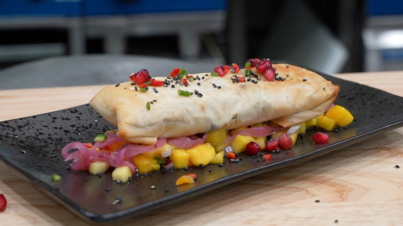 Jerk spring roll with marinated mango and pickled red onions - Bidfood
