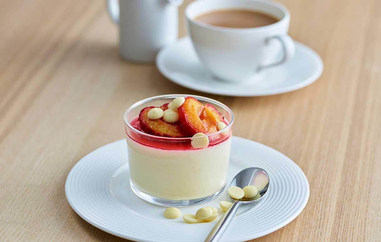 Philadelphia vanilla panna cotta, poached plums and white chocolate - Bidfood