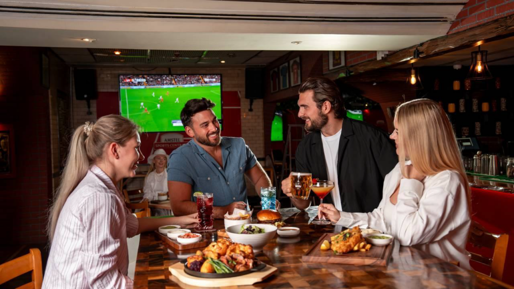 customers watching sporting events at pub